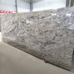 Blue Dunes Granite slab with flowing blue and beige patterns