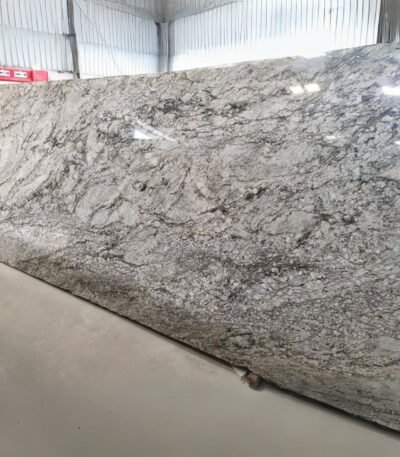 Blue Dunes Granite slab with flowing blue and beige patterns
