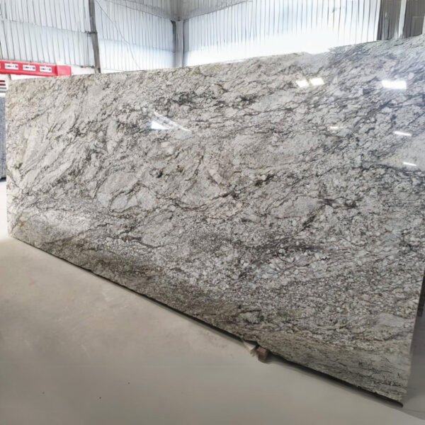 Blue Dunes Granite slab with flowing blue and beige patterns