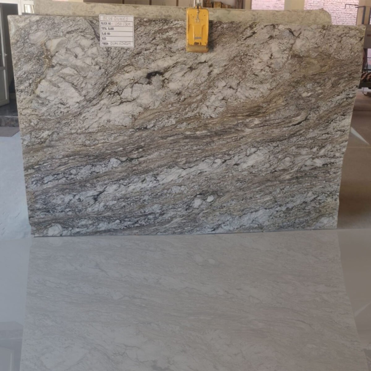 Blue Dunes Granite slab with flowing blue and beige patterns