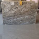 Blue Dunes Granite slab with flowing blue and beige patterns