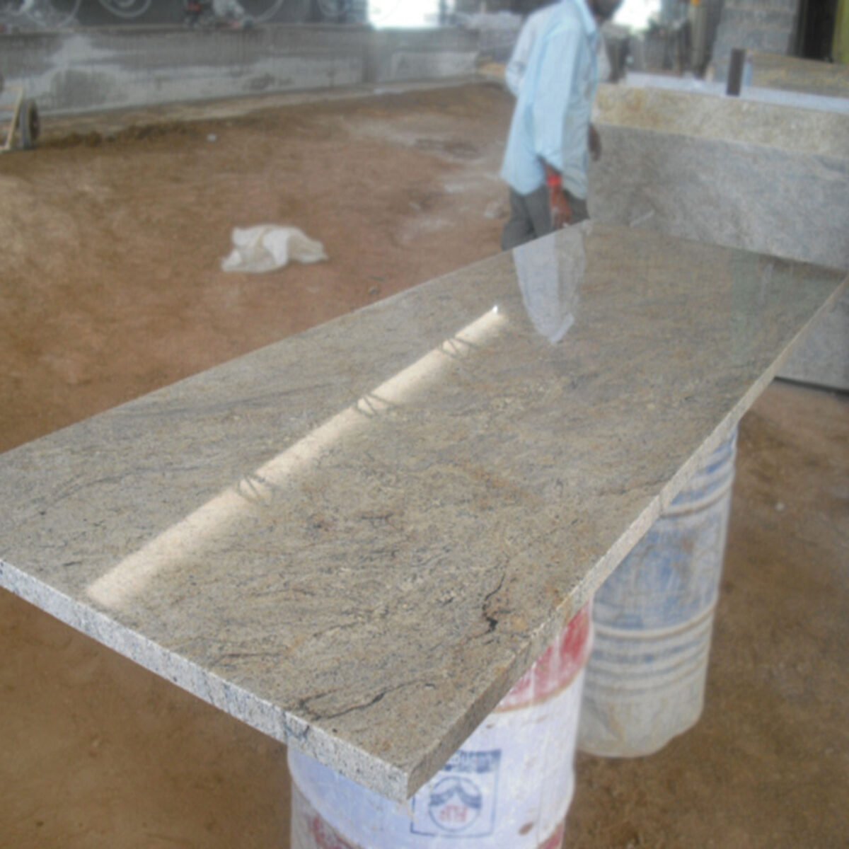 Close-up of Ivory Fantasy Granite surface texture and patterns