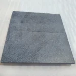 Smooth honed black limestone flooring by Sunrise Exports
