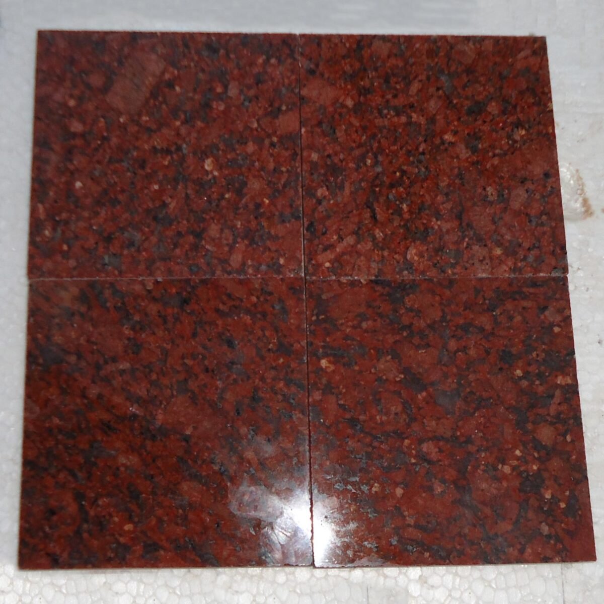 Red Granite Countertop with Black and White Flecks