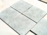 Blue-grey limestone tiles with brushed finish