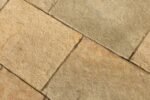 Brown stone slabs with brushed and tumbled finishes
